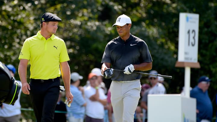 NORTON, MA - SEPTEMBER 02: Bryson DeChambeau and Tiger Woods walk away from the 13th tee during the third round of the Dell Technologies Championship at TPC Boston on September 2, 2018 in Norton, Massachusetts. (Photo by Tracy Wilcox/PGA TOUR)