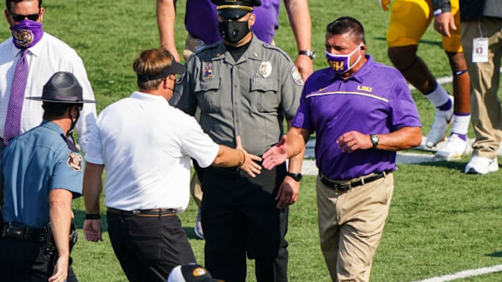 Oct 10, 2020; Columbia, Missouri, USA; LSU Tigers head coach Ed Orgeron shakes hands with Missouri Tigers head coach Eliah Drinkwitz after the game at Faurot Field at Memorial Stadium. Mandatory Credit: Jay Biggerstaff-USA TODAY Sports Oct 10, 2020; Columbia, Missouri, USA; LSU Tigers head coach Ed Orgeron shakes hands with Missouri Tigers head coach Eliah Drinkwitz after the game at Faurot Field at Memorial Stadium. Mandatory Credit: Jay Biggerstaff-USA TODAY Sports