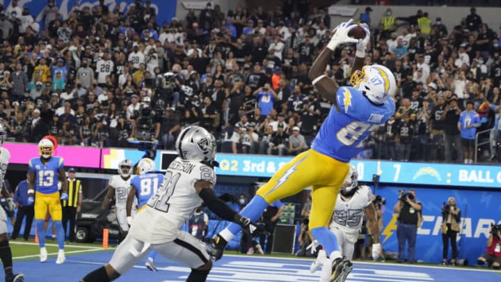 Oct 4, 2021; Inglewood, California, USA; Los Angeles Chargers tight end Jared Cook (87) catches a pass for a touchdown against Las Vegas Raiders cornerback Amik Robertson (21) during the first half at SoFi Stadium. Mandatory Credit: Robert Hanashiro-USA TODAY Sports
