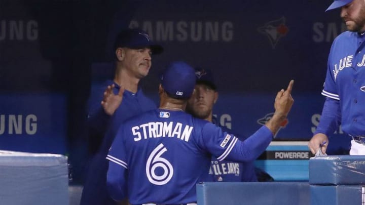 TORONTO, ON - MAY 11: Pitching coach Pete Walker #40 of the Toronto Blue Jays tries to soothe Marcus Stroman #6 who reacts as he is taken out of the game in the seventh inning during MLB game action against the Chicago White Sox at Rogers Centre on May 11, 2019 in Toronto, Canada. (Photo by Tom Szczerbowski/Getty Images)