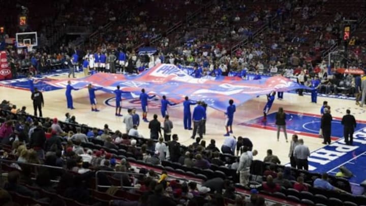 Nov 18, 2015; Philadelphia, PA, USA; The Sixers flight squad holds a giant Philadelphia 76ers flag on the court to start the second half against the Indiana Pacers at Wells Fargo Center. The Pacers won 112-85. Mandatory Credit: Bill Streicher-USA TODAY Sports