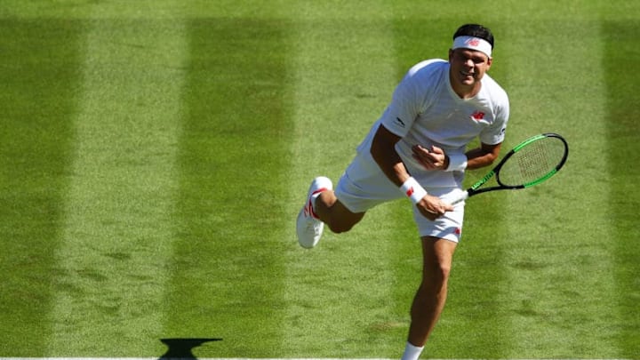 LONDON, ENGLAND - JULY 02: Milos Raonic of Canada returns to Liam Broady of Great Britain during their Men's Singles first round match on day one of the Wimbledon Lawn Tennis Championships at All England Lawn Tennis and Croquet Club on July 2, 2018 in London, England. (Photo by Clive Mason/Getty Images)