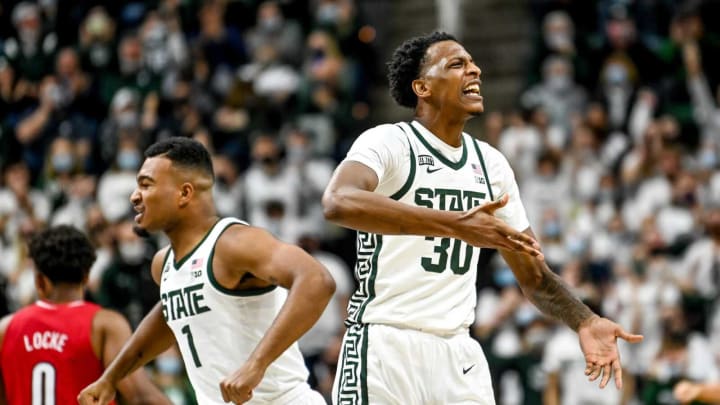 Michigan State’s Marcus Bingham Jr., right, celebrates after his dunk with Pierre Brooks, left, during the second half in the game against Louisville on Wednesday, Dec. 1, 2021, at the Breslin Center in East Lansing.211201 Msu Lville 143a