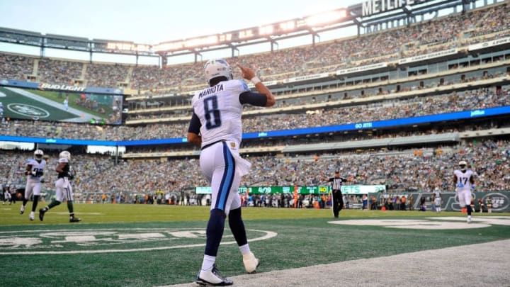 EAST RUTHERFORD, NJ - DECEMBER 13: Marcus Mariota #8 of the Tennessee Titans celebrates after completing a pass from Antonio Andrews #26 for a touchdown in the third quarter against the New York Jets during their game at MetLife Stadium on December 13, 2015 in East Rutherford, New Jersey. (Photo by Alex Goodlett/Getty Images)