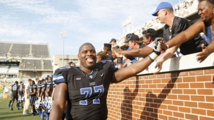 Oct 11, 2014; Atlanta, GA, USA; Duke Blue Devils guard Laken Tomlinson (77) celebrates a victory against the Georgia Tech Yellow Jackets at Bobby Dodd Stadium. Duke defeated Georgia Tech 31-25. Mandatory Credit: Brett Davis-USA TODAY Sports Oct 11, 2014; Atlanta, GA, USA; Duke Blue Devils guard Laken Tomlinson (77) celebrates a victory against the Georgia Tech Yellow Jackets at Bobby Dodd Stadium. Duke defeated Georgia Tech 31-25. Mandatory Credit: Brett Davis-USA TODAY Sports