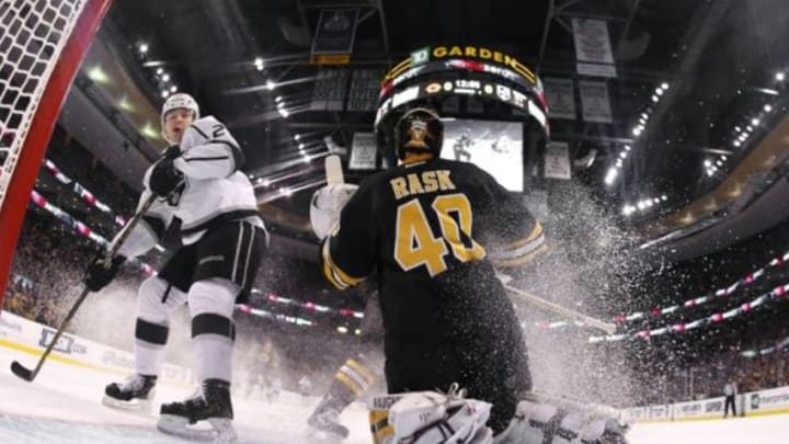 Jan 31, 2015; Boston, MA, USA; The puck deflects high in the air after a save by Boston Bruins goalie Tuukka Rask (40)as Los Angeles Kings right wing Dustin Brown (23) looks on during the third period of the Boston Bruins 3-1 win over the Los Angeles Kings at TD Garden. Mandatory Credit: Winslow Townson-USA TODAY Sports