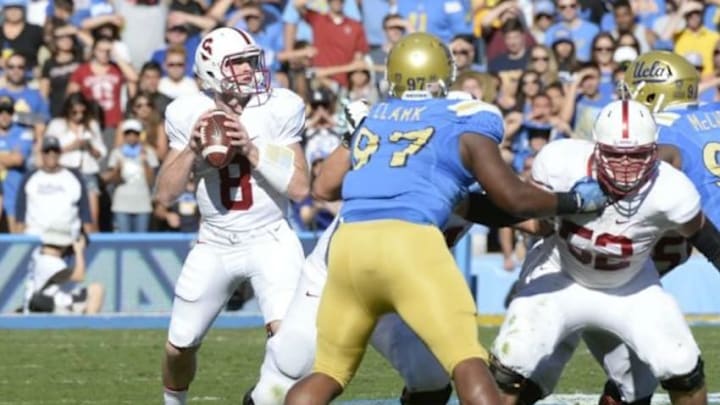 Nov 28, 2014; Pasadena, CA, USA; Stanford Cardinal quarterback Kevin Hogan (8) drops back to pass against the UCLA Bruins during the first half of the game at Rose Bowl. Mandatory Credit: Richard Mackson-USA TODAY Sports Nov 28, 2014; Pasadena, CA, USA; Stanford Cardinal quarterback Kevin Hogan (8) drops back to pass against the UCLA Bruins during the first half of the game at Rose Bowl. Mandatory Credit: Richard Mackson-USA TODAY Sports