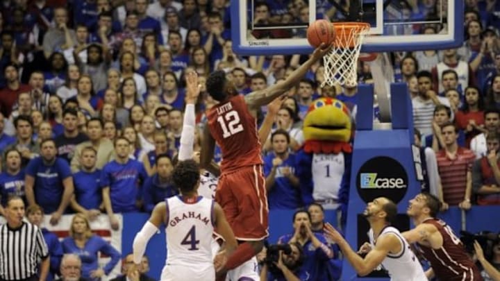 Jan 4, 2016; Lawrence, KS, USA; Oklahoma Sooners forward Khadeem Lattin (12) shoots a basket against the Kansas Jayhawks in the third overtime at Allen Fieldhouse. Kansas won the game 109-106 in triple overtime. Mandatory Credit: John Rieger-USA TODAY Sports