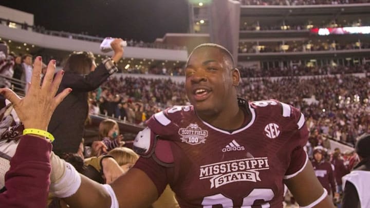 Nov 1, 2014; Starkville, MS, USA; Mississippi State Bulldogs defensive lineman Chris Jones (96) celebrates with the fans during the game against the Arkansas Razorbacks at Davis Wade Stadium. The Bulldogs defeat the Razorbacks 17-10. Mandatory Credit: Marvin Gentry-USA TODAY Sports