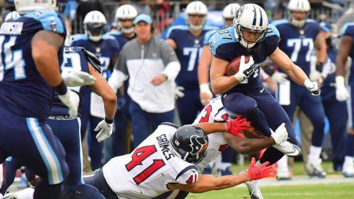Jan 1, 2017; Nashville, TN, USA; Tennessee Titans wide receiver Marc Mariani (87) is defended by Houston Texans running back Jonathan Grimes (41) in the first quarter at Nissan Stadium. Mandatory Credit: Jim Brown-USA TODAY Sports