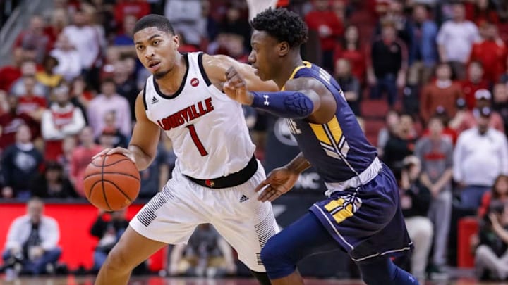 LOUISVILLE, KY - DECEMBER 15: Christen Cunningham #1 of the Louisville Cardinals dribbles the ball against Antonio Williams #4 of the Kent State Golden Flashes at KFC YUM! Center on December 15, 2018 in Louisville, Kentucky. (Photo by Michael Hickey/Getty Images)