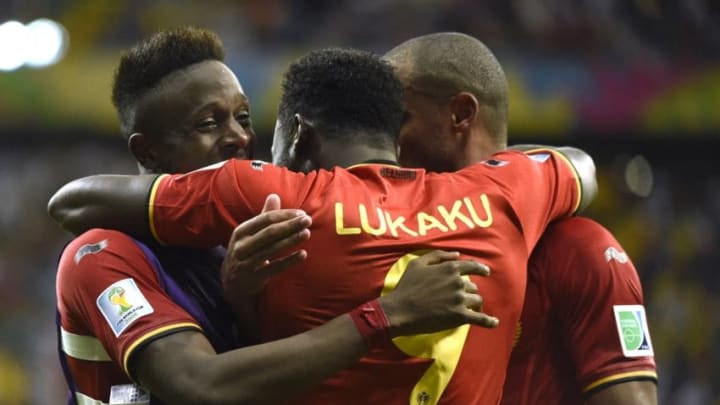 Romelu Lukaku of Belgium and Vincent Kompany of Belgium celebrate scoring a goal and Divock Origi of Belgium during a FIFA 2014 World Cup Round of 16 match between Belgium and USA at the Arena Fonte Nova stadium in Salvador, Brazil. (Photo by William Van Hecke/Corbis via Getty Images)