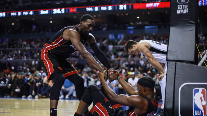 Bam Adebayo #13 of the Miami Heat helps to stand up to Jimmy Butler #22 of the Miami Heat(Photo by Manuel Velasquez/Getty Images)