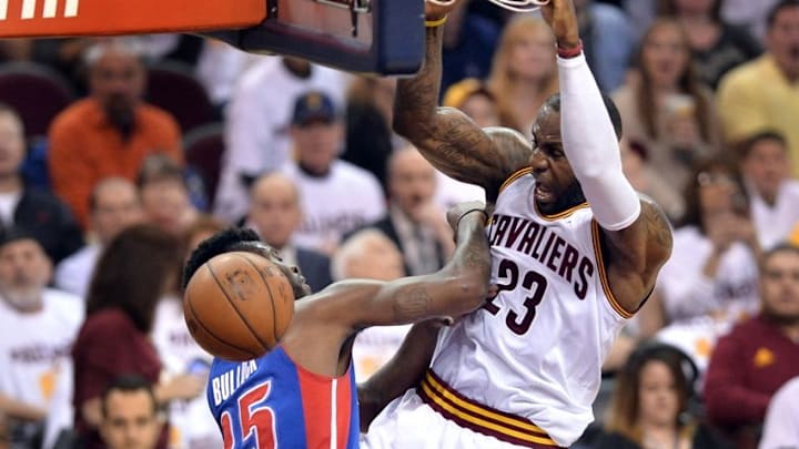 Apr 20, 2016; Cleveland, OH, USA; Cleveland Cavaliers forward LeBron James (23) slam dunks over Detroit Pistons forward Reggie Bullock (25) during the second quarter in game two of the first round of the NBA Playoffs at Quicken Loans Arena. Mandatory Credit: Ken Blaze-USA TODAY Sports