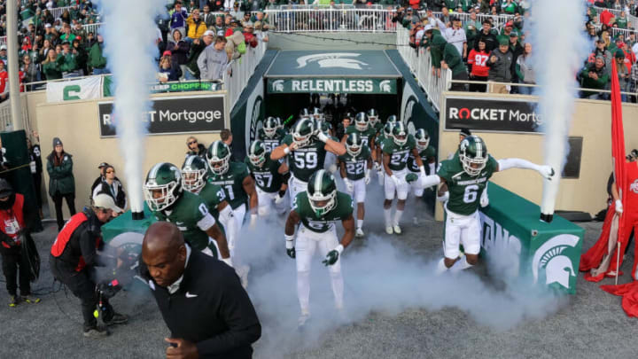 EAST LANSING, MICHIGAN - OCTOBER 08: Head coach Mel Tucker of the Michigan State Spartans leads his team onto the field to play the Ohio State Buckeyes at Spartan Stadium on October 08, 2022 in East Lansing, Michigan. (Photo by Gregory Shamus/Getty Images)