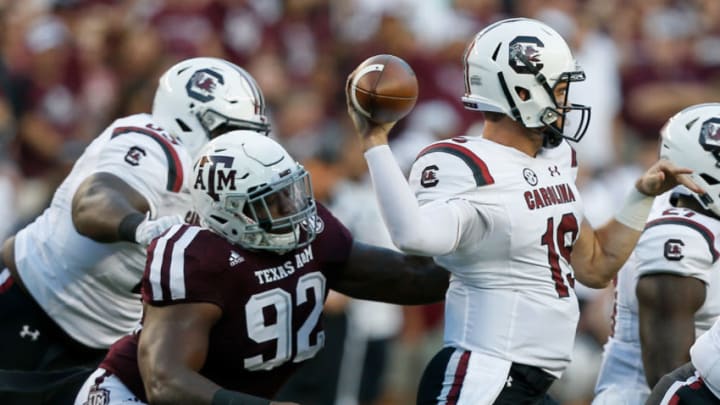 COLLEGE STATION, TX - SEPTEMBER 30: Jake Bentley #19 of the South Carolina Gamecocks throws a pass as he receives pressure from Zaycoven Henderson #92 of the Texas A&M Aggies at Kyle Field on September 30, 2017 in College Station, Texas. (Photo by Bob Levey/Getty Images)