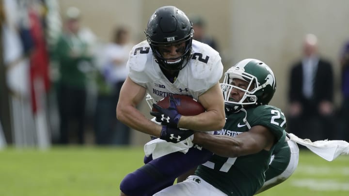 EAST LANSING, MI – OCTOBER 6: Wide receiver Flynn Nagel #2 of the Northwestern Wildcats is tackled by safety Khari Willis #27 of the Michigan State Spartans during the second half at Spartan Stadium on October 6, 2018 in East Lansing, Michigan. Northwestern defeated Michigan State 29-19. (Photo by Duane Burleson/Getty Images)