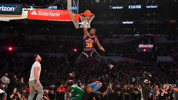 LOS ANGELES, CA - FEBRUARY 17: Donovan Mitchell #45 of the Utah Jazz dunks over Kevin Hart and crew during the Verizon Slam Dunk Contest during State Farm All-Star Saturday Night as part of the 2018 NBA All-Star Weekend on February 17, 2018 at STAPLES Center in Los Angeles, California. Copyright 2018 NBAE (Photo by Jesse D. Garrabrant/NBAE via Getty Images)