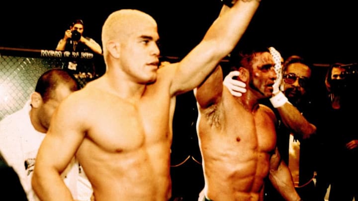 LAS VEGAS, NV - NOVEMBER 22: Ken Shamrock (R) raises Tito Ortiz's hand in victory after Ortiz defeated Shamrock by unanimous decision at UFC 40 at the MGM Grand Garden Arena on November 22, 2002 in Las Vegas, Nevada. (Photo by Josh Hedges/Zuffa LLC/Zuffa LLC via Getty Images)
