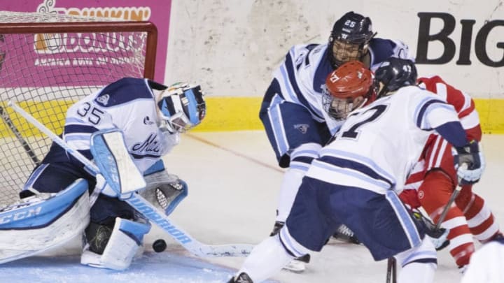 PORTLAND, ME - NOVEMBER 18: University of Maine goalie Rob McGovern get in front of the puck shot by Boston Universitys Brady Tkachuk, who is surrounded by Maine defensemen Brady Keeper and Mark Hamilton, during Hockey East action at the Cross Insurance Arena on Saturday November 18, 2017. (Photo by Carl D. Walsh/Portland Press Herald via Getty Images)