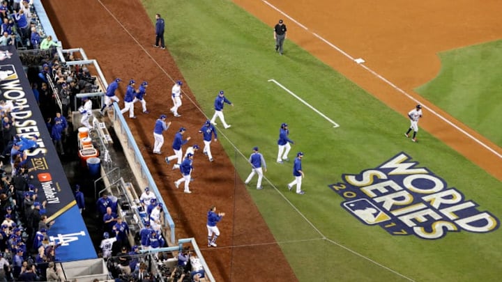 LOS ANGELES, CA - OCTOBER 31: The Los Angeles Dodgers dugout reacts after defeating the Houston Astros 3-1 in game six of the 2017 World Series at Dodger Stadium on October 31, 2017 in Los Angeles, California. (Photo by Joe Scarnici/Getty Images)