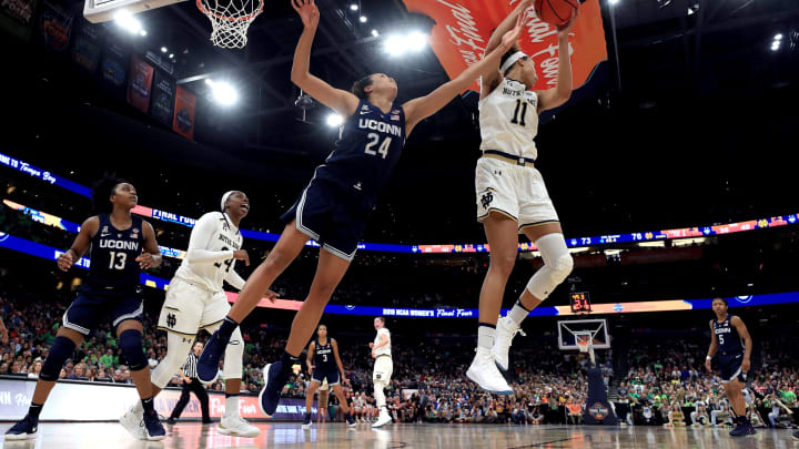 TAMPA, FLORIDA – APRIL 05: Brianna Turner #11 of the Notre Dame Fighting Irish grabs the rebound from Napheesa Collier #24 of the UConn Huskies during the fourth quarter in the semifinals of the 2019 NCAA Women’s Final Four at Amalie Arena on April 05, 2019 in Tampa, Florida. (Photo by Mike Ehrmann/Getty Images)