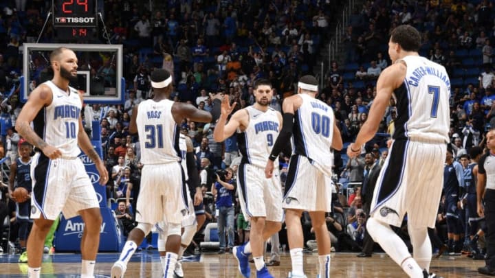 ORLANDO, FL - MARCH 22: The Orlando Magic high-five each other on the court during the game against the Memphis Grizzlies on MARCH 22, 2019 at Amway Center in Orlando, Florida. NOTE TO USER: User expressly acknowledges and agrees that, by downloading and or using this photograph, User is consenting to the terms and conditions of the Getty Images License Agreement. Mandatory Copyright Notice: Copyright 2019 NBAE (Photo by Fernando Medina/NBAE via Getty Images)