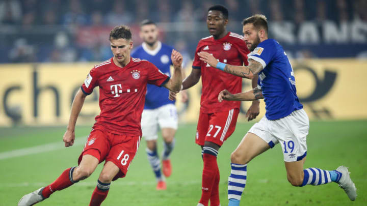 GELSENKIRCHEN, GERMANY - SEPTEMBER 22: Leon Goretzka #18 of Bayern Munich and Guido Burgstaller #19 of FC Schalke 04 battle for the ball during the Bundesliga match between FC Schalke 04 and FC Bayern Muenchen at Veltins-Arena on September 22, 2018 in Gelsenkirchen, Germany. (Photo by Maja Hitij/Bongarts/Getty Images)