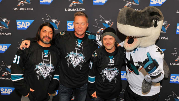 SAN JOSE, CA - JANUARY 21: (L-R) Larry Trujillo, James Hetfield and Lars Ulrich of Metallica receive San Jose Sharks jerseys at Metallica Night At The San Jose Sharks Game on January 21, 2015 in San Jose, California. (Photo by Steve Jennings/Getty Images for BB Gun)