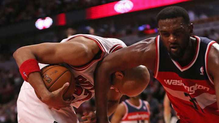 CHICAGO, IL - APRIL 17: Taj Gibson #22 of the Chicago Bulls is fouled by Chris Singleton #31 of the Washington Wizards at the United Center on April 17, 2013 in Chicago, Illinois. The Bulls defeated the Wizards 95-92. (Photo by Jonathan Daniel/Getty Images)