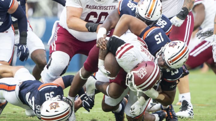 Auburn footballAUBURN, ALABAMA - SEPTEMBER 02: Quarterback Taisun Phommachanh #3 of the Massachusetts Minutemen gets sacked by safety Griffin Speaks #39 of the Auburn Tigers, defensive lineman Keldric Faulk #15 of the Auburn Tigers and defensive lineman Garrison Walker #96 of the Auburn Tigers at Jordan-Hare Stadium on September 02, 2023 in Auburn, Alabama. (Photo by Michael Chang/Getty Images)