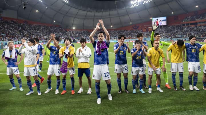 DOHA, QATAR - DECEMBER 01: Japan players celebrate winning the group as they applaud their fans at the end of the FIFA World Cup Qatar 2022 Group E match between Japan and Spain at Khalifa International Stadium on December 1, 2022 in Doha, Qatar. (Photo by Sebastian Frej/MB Media)
