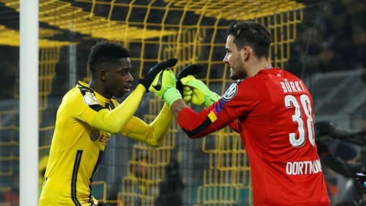 DORTMUND, GERMANY - FEBRUARY 8: Ousmane Dembele (L) and Roman Burki (R) of Borussia Dortmund celebrate during penalty shoot-out of the DFB Cup match between Borussia Dortmund and Hertha BSC Berlin at the Signal Iduna Park stadium in Dortmund, Germany on February 08, 2017. (Photo by Leon Kuegeler/Anadolu Agency/Getty Images)