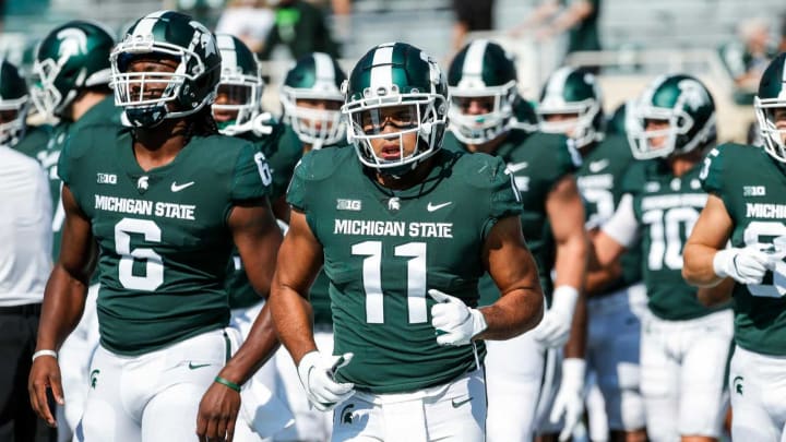Michigan State running back Connor Heyward (11) warms up before the Youngstown State game at Spartan Stadium in East Lansing on Saturday, Sept. 11, 2021.