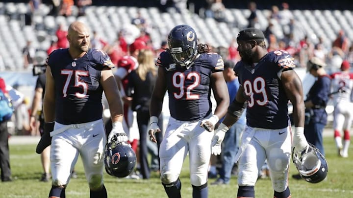 Sep 20, 2015; Chicago, IL, USA; Chicago Bears offensive tackle Kyle Long (75) outside linebacker Pernell McPhee (92) and linebacker Lamarr Houston (99) walk off the field after the NFL game against the Arizona Cardinals at Soldier Field. Cardinals won 48-23. Mandatory Credit: Kamil Krzaczynski-USA TODAY Sports