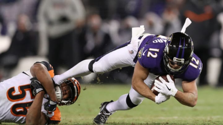 BALTIMORE, MD - DECEMBER 31: Wide Receiver Michael Campanaro #12 of the Baltimore Ravens is tackled after a catch by linebacker Hardy Nickerson #56 of the Cincinnati Bengals in the third quarter at M&T Bank Stadium on December 31, 2017 in Baltimore, Maryland. (Photo by Patrick Smith/Getty Images)