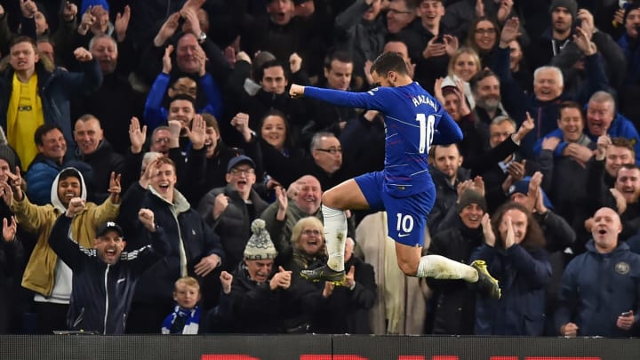 Chelsea’s Belgian midfielder Eden Hazard celebrates after scoring their second goal during the English Premier League football match between Chelsea and Brighton and Hove Albion at Stamford Bridge in London on April 3, 2019. (Photo by Glyn KIRK / AFP) / RESTRICTED TO EDITORIAL USE. No use with unauthorized audio, video, data, fixture lists, club/league logos or ‘live’ services. (Photo credit should read GLYN KIRK/AFP/Getty Images)