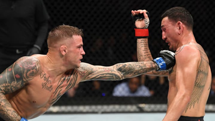 ATLANTA, GA - APRIL 13: (L-R) Dustin Poirier punches Max Holloway in their interim lightweight championship bout during the UFC 236 event at State Farm Arena on April 13, 2019 in Atlanta, Georgia. (Photo by Josh Hedges/Zuffa LLC/Zuffa LLC via Getty Images)