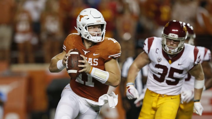 AUSTIN, TX – SEPTEMBER 15: Sam Ehlinger #11 of the Texas Longhorns rolls out to pass under pressure by Cameron Smith #35 of the USC Trojans in the first half at Darrell K Royal-Texas Memorial Stadium on September 15, 2018 in Austin, Texas. (Photo by Tim Warner/Getty Images)