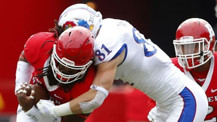 Sep 26, 2015; Piscataway, NJ, USA; Rutgers Scarlet Knights linebacker Kaiwan Lewis is tackled after intercepting a Kansas Jayhawks pass during the first half at High Points Solutions Stadium. Mandatory Credit: Noah K. Murray-USA TODAY Sports