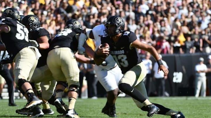 Sep 10, 2016; Boulder, CO, USA; Colorado Buffaloes quarterback Sefo Liufau (13) carries the football in the first half against the Idaho State Bengals at Folsom Field. Mandatory Credit: Ron Chenoy-USA TODAY Sports