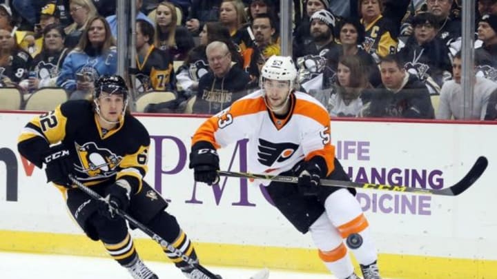 Jan 21, 2016; Pittsburgh, PA, USA; Pittsburgh Penguins left wing Carl Hagelin (62) and Philadelphia Flyers defenseman Shayne Gostisbehere (53) chase the puck during the first period at the CONSOL Energy Center. Mandatory Credit: Charles LeClaire-USA TODAY Sports