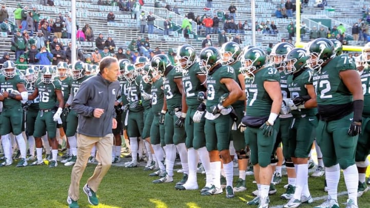Nov 28, 2015; East Lansing, MI, USA; Michigan State Spartans head coach Mark Dantonio leads the team onto the field prior to a game against the Penn State Nittany Lions at Spartan Stadium. Mandatory Credit: Mike Carter-USA TODAY Sports