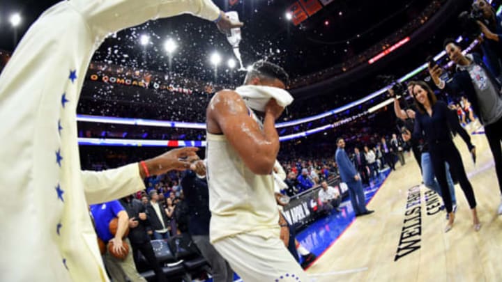 PHILADELPHIA, PA – APRIL 11: Robert Covington #33 cover Markelle Fultz #20 of the Philadelphia 76ers in water after his first career triple double against the Milwaukee Bucks on April 11, 2018 in Philadelphia, Pennsylvania NOTE TO USER: User expressly acknowledges and agrees that, by downloading and/or using this Photograph, user is consenting to the terms and conditions of the Getty Images License Agreement. Mandatory Copyright Notice: Copyright 2018 NBAE (Photo by Jesse D. Garrabrant/NBAE via Getty Images)