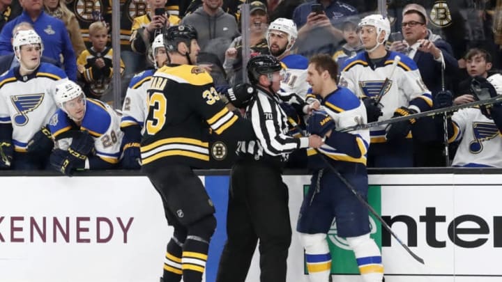 BOSTON, MA - OCTOBER 26: Boston Bruins left defenseman Zdeno Chara (33) and St. Louis Blues center Brayden Schenn (10) are separated by linesman Derek Nansen (70) during a game between the Boston Bruins and the St. Louis Blues on October 26, 2019, at TD Garden in Boston, Massachusetts. (Photo by Fred Kfoury III/Icon Sportswire via Getty Images)