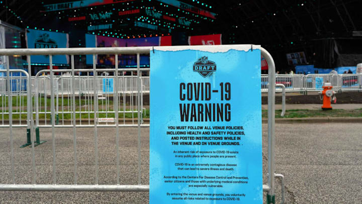 Apr 29, 2021; Cleveland, Ohio, USA; A COVID-19 warning sign at the 2021 NFL Draft at First Energy Stadium. Mandatory Credit: Kirby Lee-USA TODAY Sports