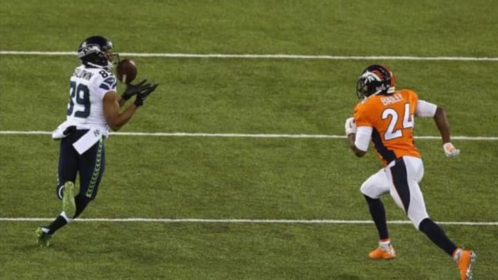 Feb 2, 2014; East Rutherford, NJ, USA; Seattle Seahawks wide receiver Doug Baldwin (89) makes a catch against Denver Broncos cornerback Champ Bailey (24) during the first quarter in Super Bowl XLVIII at MetLife Stadium. Mandatory Credit: Noah K. Murray-USA TODAY Sports