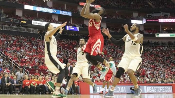 Dec 25, 2015; Houston, TX, USA; Houston Rockets guard James Harden (13) drives against the San Antonio Spurs in the second half of a NBA basketball game on Christmas at Toyota Center. Rockets won 88 to 84. Mandatory Credit: Thomas B. Shea-USA TODAY Sports