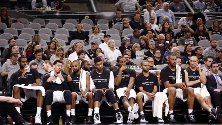Apr 19, 2016; San Antonio, TX, USA; San Antonio Spurs players (from left to right) LaMarcus Aldridge, and Danny Green, and Patty Mills, and Tim Duncan, and Kawhi Leonard, and Tony Parker, and Boris Diaw, and Manu Ginobili (20) watch on the bench against the Memphis Grizzlies in game two of the first round of the NBA Playoffs at AT&T Center. Mandatory Credit: Soobum Im-USA TODAY Sports