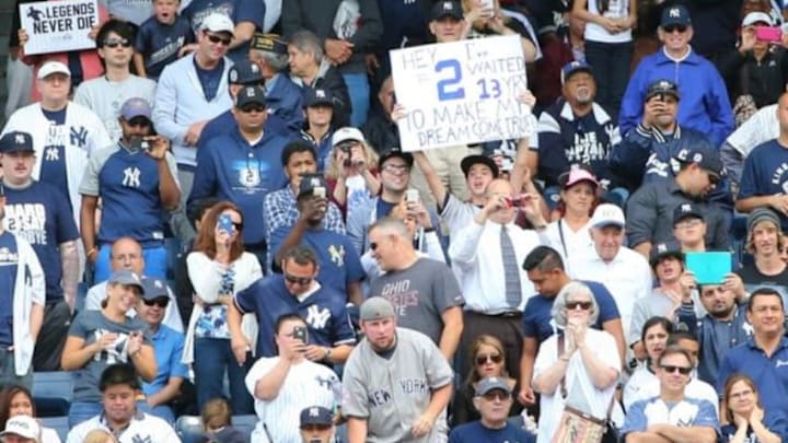 Sep 24, 2014; Bronx, NY, USA; Fans display signs for New York Yankees shortstop Derek Jeter (not pictured) during the third inning against the Baltimore Orioles at Yankee Stadium. Mandatory Credit: Anthony Gruppuso-USA TODAY Sports
